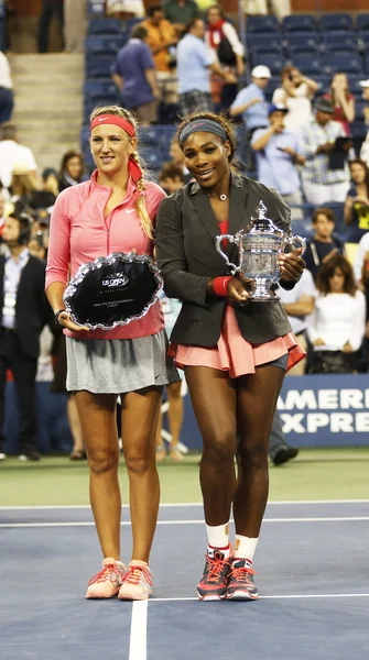 US Open 2013 champion Serena Williams and runner up Victoria Azarenka holding US Open trophies after final match at Billie Jean King National Tennis Center