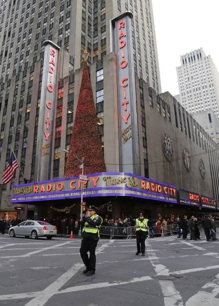 NYPD officers regulate traffic during gridlock near New York City landmark Radio City Music Hall