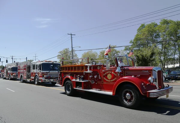 1950 Mack fire truck from Huntington Manor Fire Department leading firetrucks parade in Huntington, New York