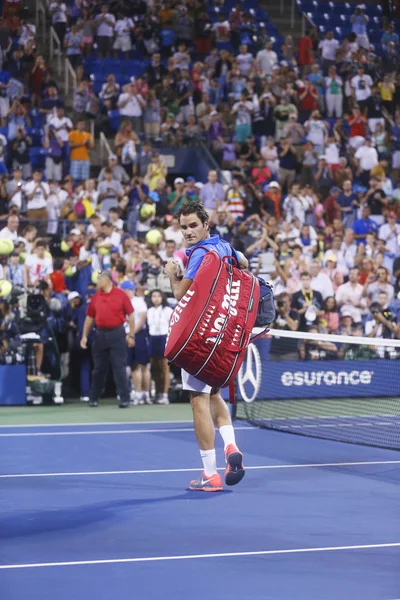 Seventeen times Grand Slam champion Roger Federer leaving stadium after loss in fourth round match at US Open 2013 against Tommy Robredo at Billie Jean King National Tennis Center