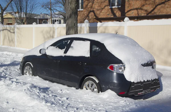 Car under snow in Brooklyn, NY after massive Winter Storm Janus strikes Northeast