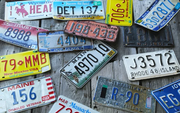 Old car license plates on the wall in Bar Harbor