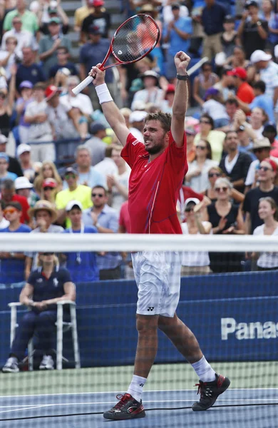 Professional tennis player Stanislas Wawrinka celebrates victory after third round match at US Open 2013