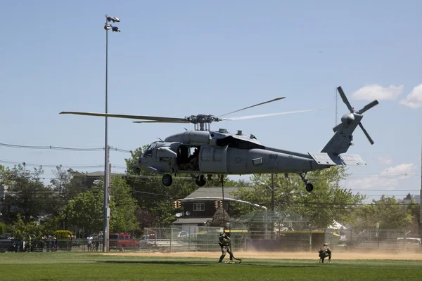 MH-60S helicopter from Helicopter Sea Combat Squadron Five with US Navy EOD team landing for mine countermeasures demonstration