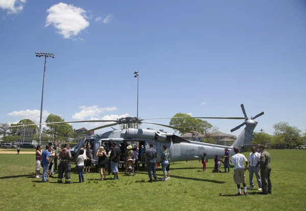 Numerous spectators around MH-60S helicopter from Helicopter Sea Combat Squadron Five during Fleet Week 2014