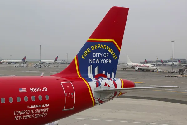 JetBlue Airbus A320 tailfin Honoring the brave men and women Fire Department City of NY at the gate at the Terminal 5 at John F Kennedy International Airport in New York