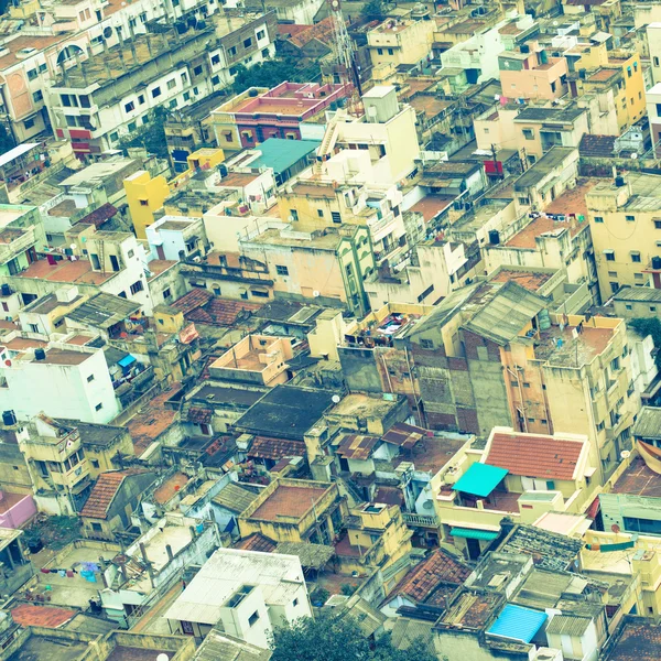 Retro style  image of colorful homes in crowded Indian city Tri