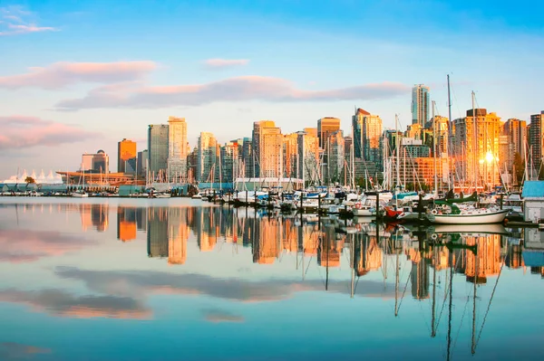 Beautiful view of Vancouver skyline with harbor at sunset, BC, Canada
