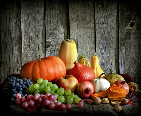 Fruits and vegetables with pumpkins in autumn vintage still life