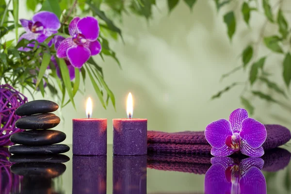 Zen stones orchid aromatic candles and towel spa concept