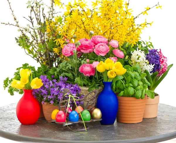 Colorful spring flowers and easter eggs decoration