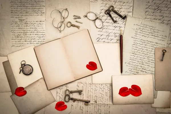 Open book, antique accessories, old love letters