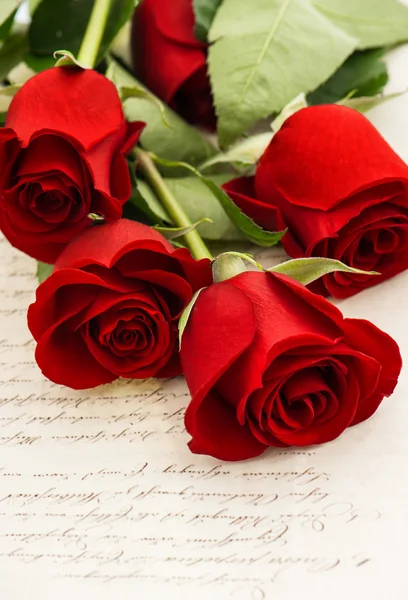 Red rose flowers and old love letters