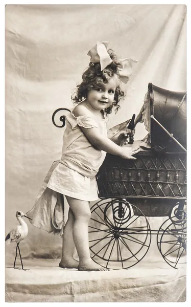 Old photo of little girl with toys