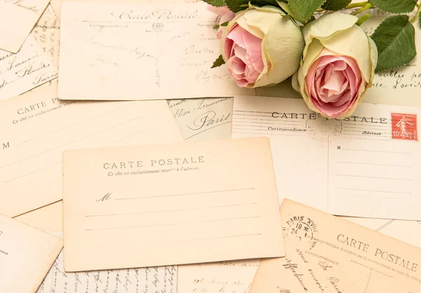 Vintage postcards and rose flowers. old love letters