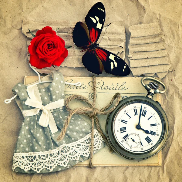 Old love mails, vintage pocket watch, red rose flower and butter