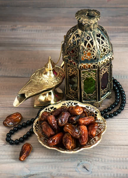 Dates, arabic lantern and rosary. Oriental decoration