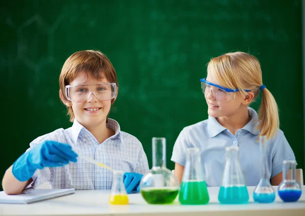 Children at chemistry lesson
