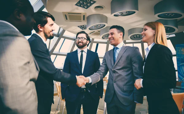 Business people handshaking