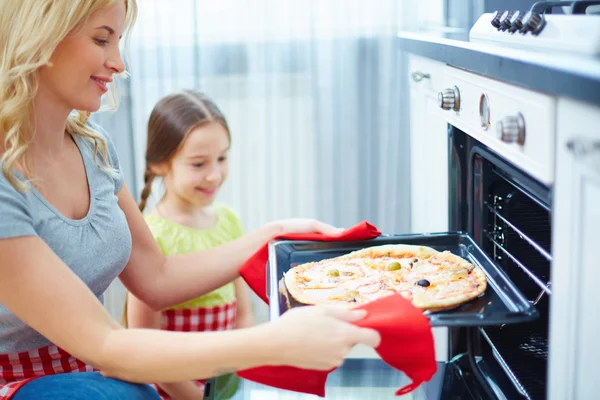 Mother and daughter cooking