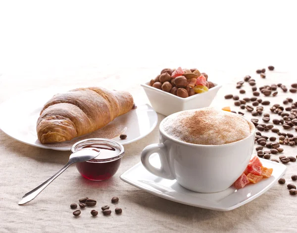 Breakfast with coffe and croissant