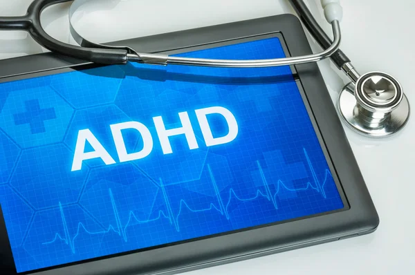 Tablet with the diagnosis adhd on the display