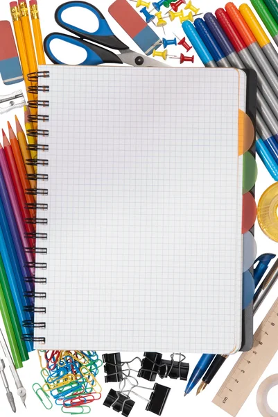 Notepad with stationary objects in the background