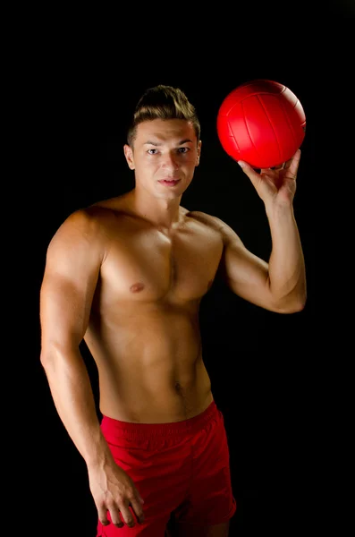 Man with a red volley ball