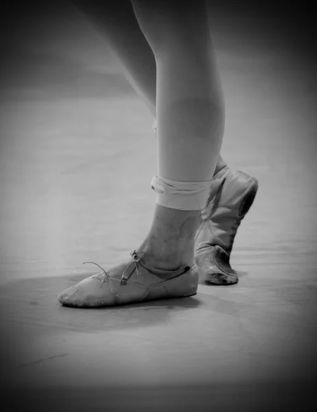 Dancer\'s feet with old shoes and bandage