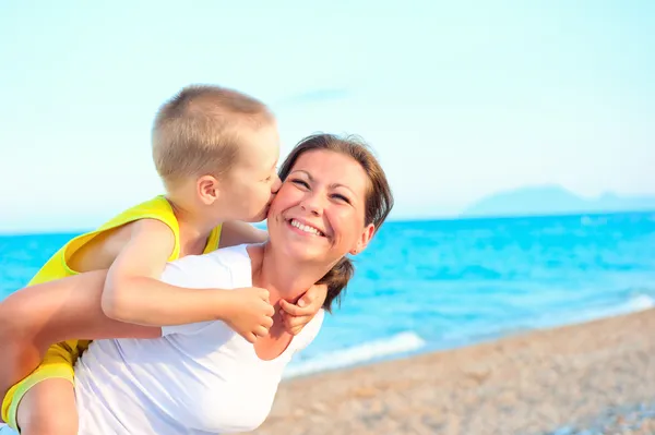 Son kissing and hugging her mother