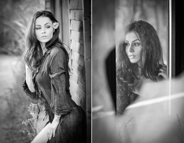 Fashion portrait of sexy brunette in black blouse leaning on wooden cabin wall. Sensual attractive woman with a flower in hair, black and white photo. Perfect body girl with long hair posing outdoor