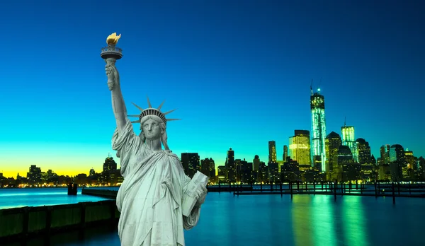 Liberty Statue with New York ar night