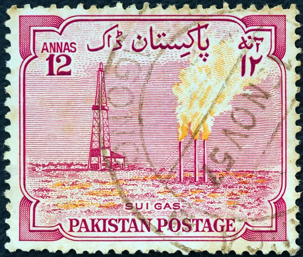 PAKISTAN - CIRCA 1955: A stamp printed in Pakistan issued for the 8th anniversary of Independence shows Main Sui gas plant, circa 1955.