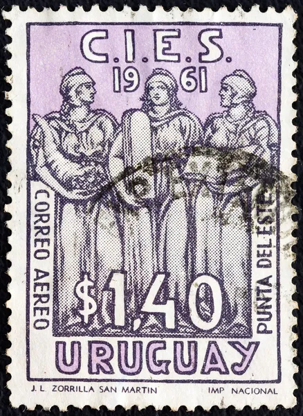 URUGUAY - CIRCA 1961: A stamp printed in Uruguay issued for the Latin-American Economic Commission Conference, Punta del Este shows Welfare, Justice and Education, circa 1961.