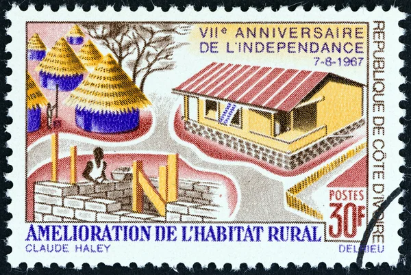 IVORY COAST - CIRCA 1967: A stamp printed in Ivory Coast issued for the 7th anniversary of Independence shows improvement of Rural Housing , circa 1967.