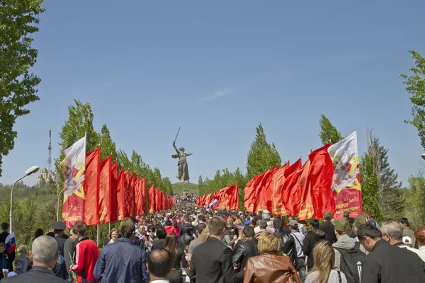 Huge number of people rises up the stairs on the Mamayev Kurgan