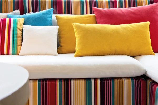 Colorful cushions in sofa.