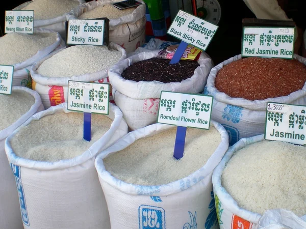 Bags of different varieties of rice in the food market in Cambodia