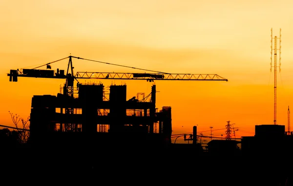 Industrial building construction cranes silhouettes