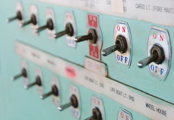Close up shot of toggle switch on off button panel on cargo vessel — Stock Photo #34427115