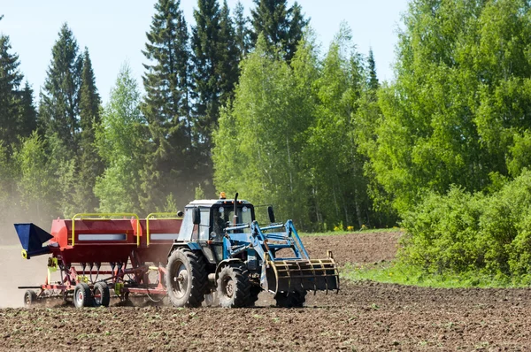 Tractors planting farm fields