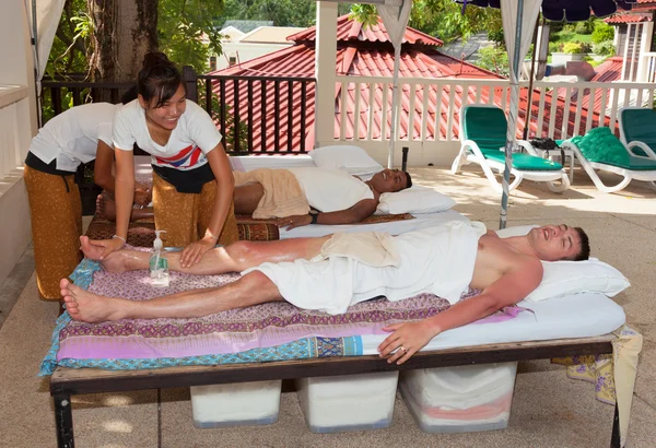 Patong - April 26: Men get a Thai massage. Thailand, Phuket, Pa