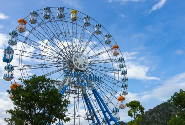 HUA HIN, THAILAND- JUL 1, 2013: Ferris wheel on the blue sky on Jul 1, 2013 Hua Hin, Thailand at Santorini park is famous attraction in Hua Hin