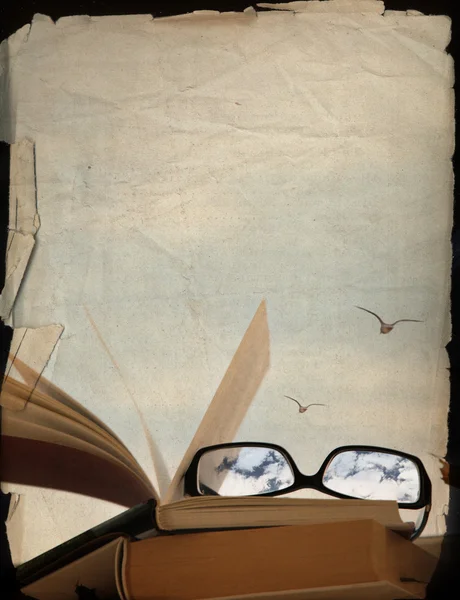 Vintage background, books and glasses, dreaming of the vacation