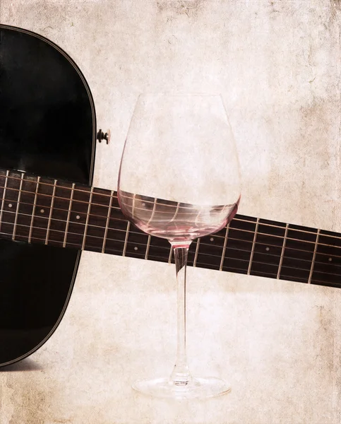 Artwork in grunge style, guitar and empty glass