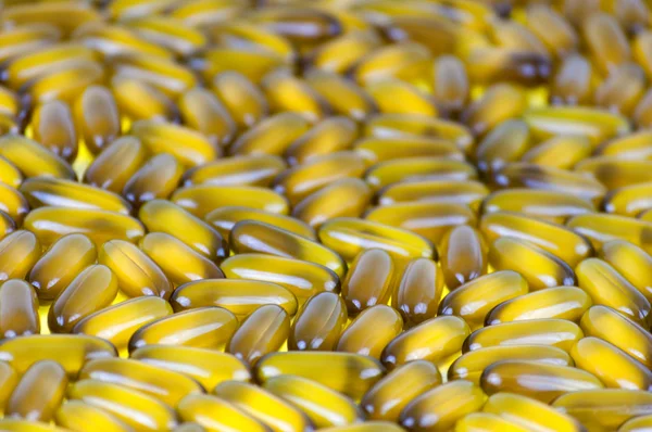 Closeup of group of coconut oil capsules Selective Focus