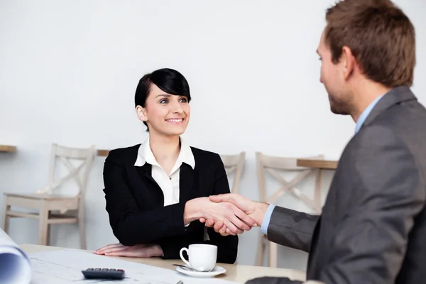 Two businesspeople shaking hands