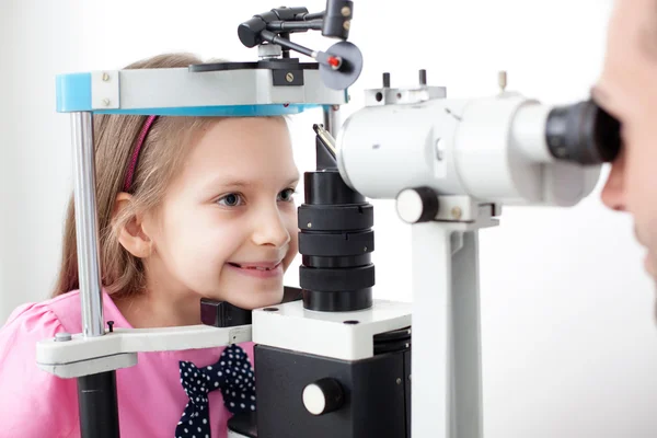 Young girl patient is having a medical attendance at the optomet