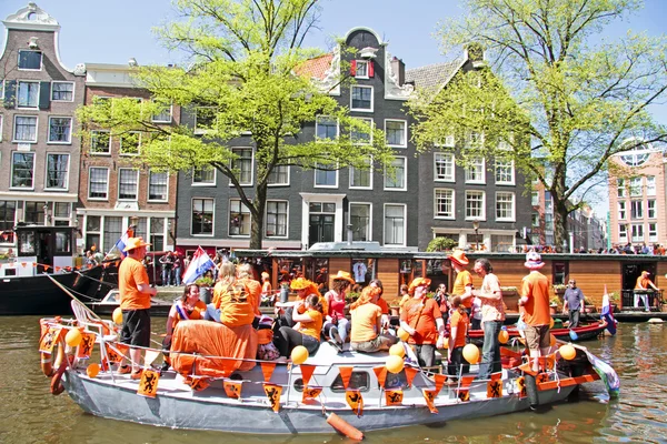 AMSTERDAM, NETHERLANDS - APRIL 30: in orange cruising thr