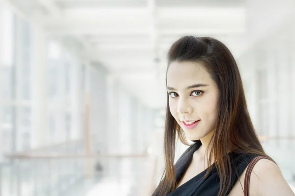 Confident woman in the city, with casual black dress